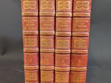 a set of five red books sitting on top of each other