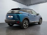 the rear end of a blue suv parked in a garage