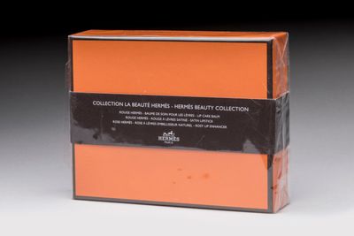 an orange box with a black stripe on the front of it