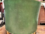 an image of a green chair sitting on top of a wooden table