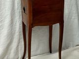 a small wooden table with a drawer on top of it
