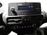 the dashboard of a car with a radio, steering wheel, and dashboard controls