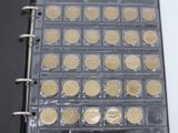 a picture of a binder with a lot of coins in it