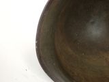 a brown bowl sitting on top of a white table