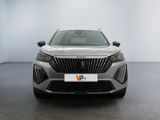 the front view of a silver car in a white room