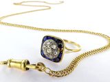 an image of a gold chain with a blue and white diamond ring and a gold chain with a blue and white diamond ring and a gold chain with a blue and