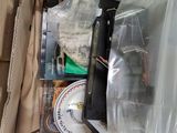 a cardboard box filled with cds and other items