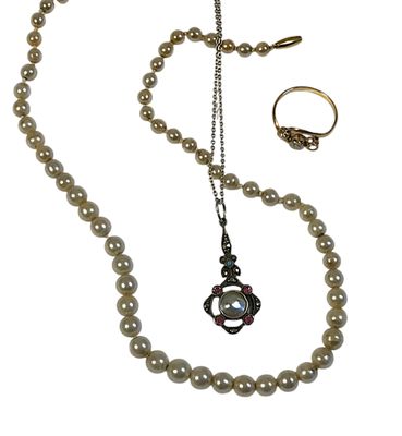 an image of a necklace and ring with pearls on a white background