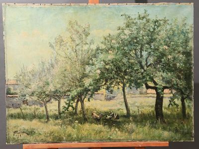 a painting on a easel with a painting of trees in the background
