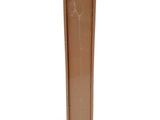 a brown vase that is sitting on a white surface