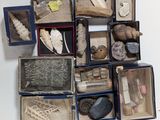a lot of different items in a box on the table