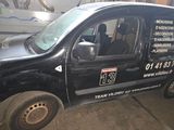 a black van that is parked in a garage