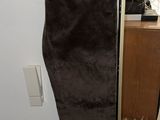 a picture of a pair of brown pants hanging on a wall