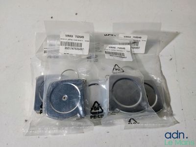 two pieces of plastic that are sitting on a table
