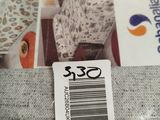 a close up of a bag of fabric with a tag on it