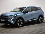 un SUV bleu garé sur un sol à damier dans un showroom