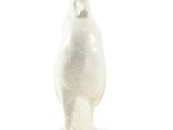 a white sculpture of a bird on a white surface