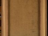 a painting on a wooden easel with a black background