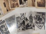 many old black and white photos on a table