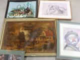 beaucoup d'œuvres d'art encadrées posées par terre dans une pièce
