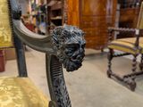 a lion head on the back of a chair in a store