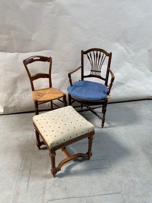 three chairs and a stool in front of a white backdrop