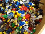 a bowl full of legos sitting on a table