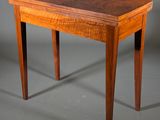 an image of a small table with a wooden top and legs
