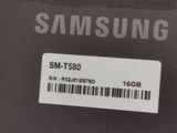 the back of a black samsung phone with a barcode on it