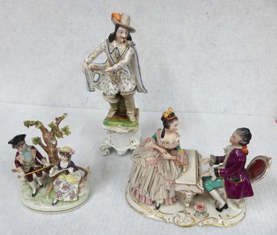 four figurines of people sitting on a bench