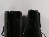 two pieces of luggage that are sitting on a table