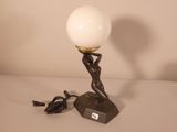 a lamp that is sitting on a table next to a charger