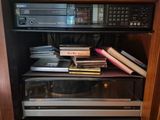 a shelf that has a bunch of books on top of it