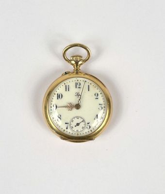 a gold pocket watch on a white surface