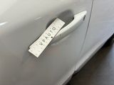 a sticker that says vauto on the door handle of a car