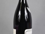 a bottle of wine that is sitting on a table