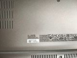 a close up of a silver laptop with a black keyboard