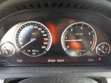 a close up of a car dashboard with various gauges