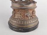 a statue of a man on a horse on a pedestal