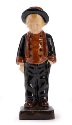 a figurine of a man wearing a hat and jacket