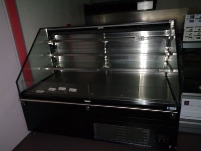 a refrigerated counter in a restaurant kitchen