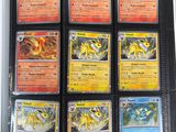 a lot of pokemon cards on the table