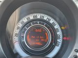 a close up of a car dashboard with a speedometer