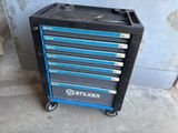 a black and blue tool cabinet with six drawers