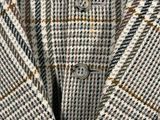 a close up of a man ' s jacket and tie