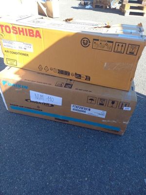 two boxes stacked on top of each other on the ground