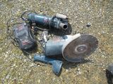 a picture of a broken drill and other tools on the ground