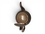 an image of a metal object with a bowl on it