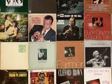 a lot of records on the wall of a room