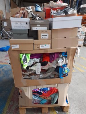 a cart full of boxes and other items in a warehouse